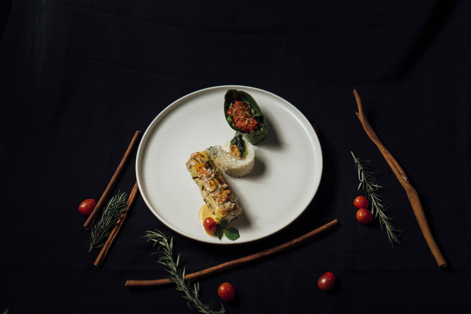 Plated tasting menu on dark surface